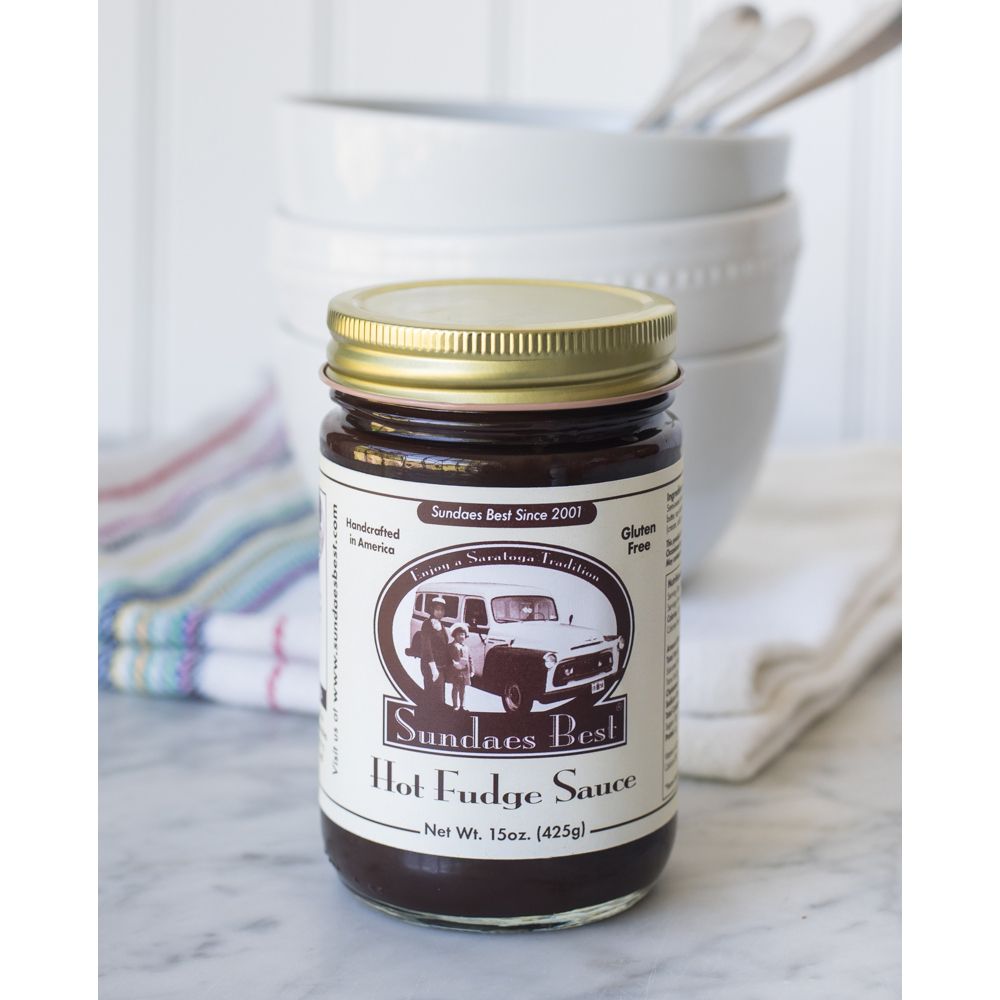 Jar of Sundaes Best Hot Fudge in front of white ceramic bowls