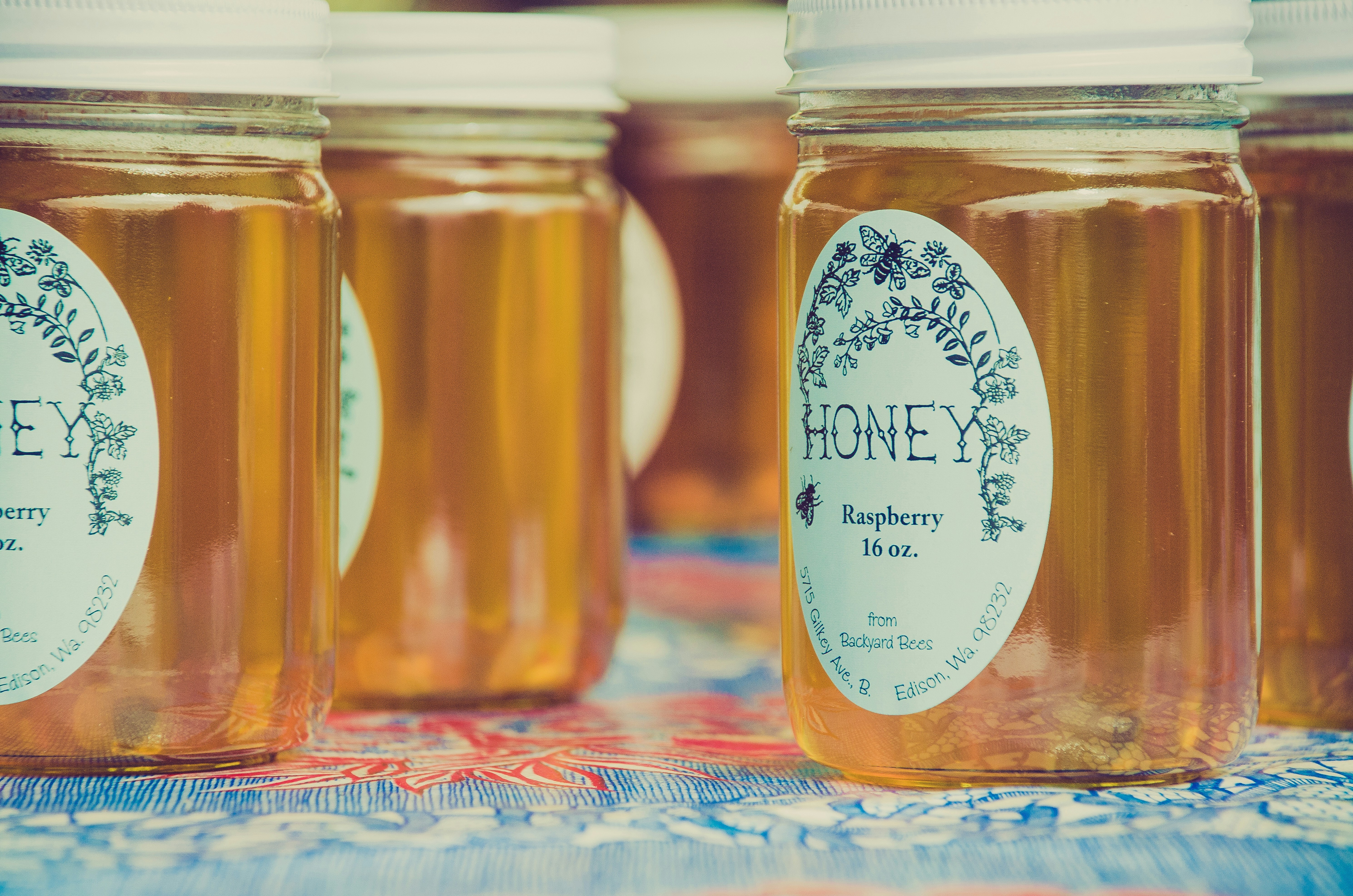 Glass honey jars on a shelf