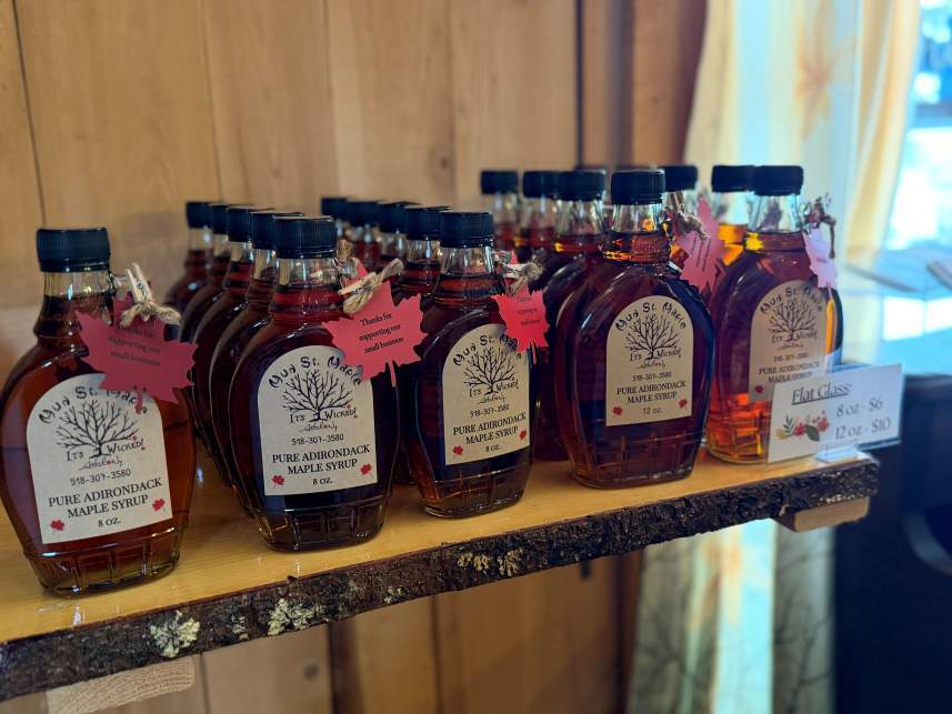 A selection of maple syrups on a shelf
