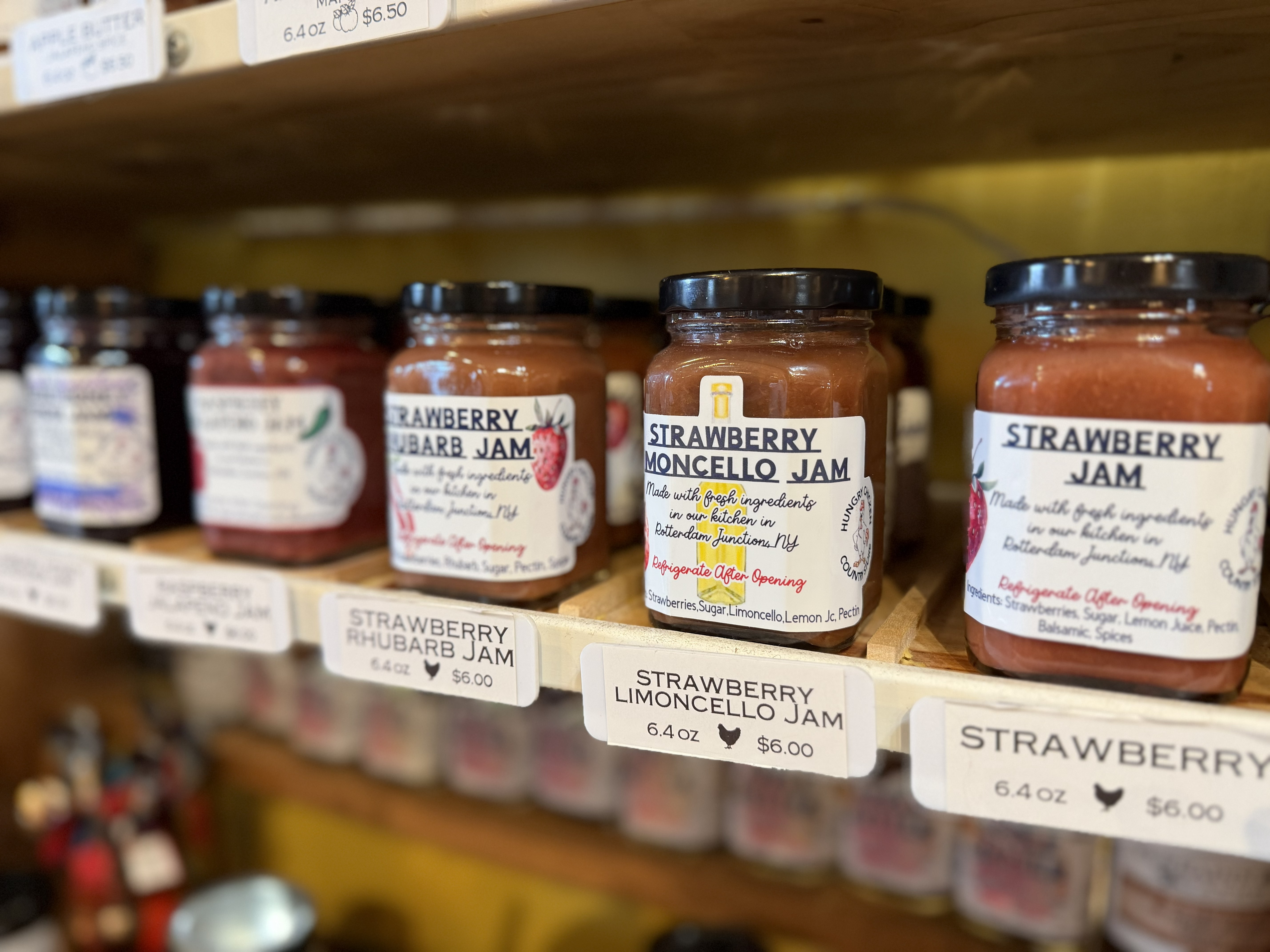 A row of jams in colonial glass jars