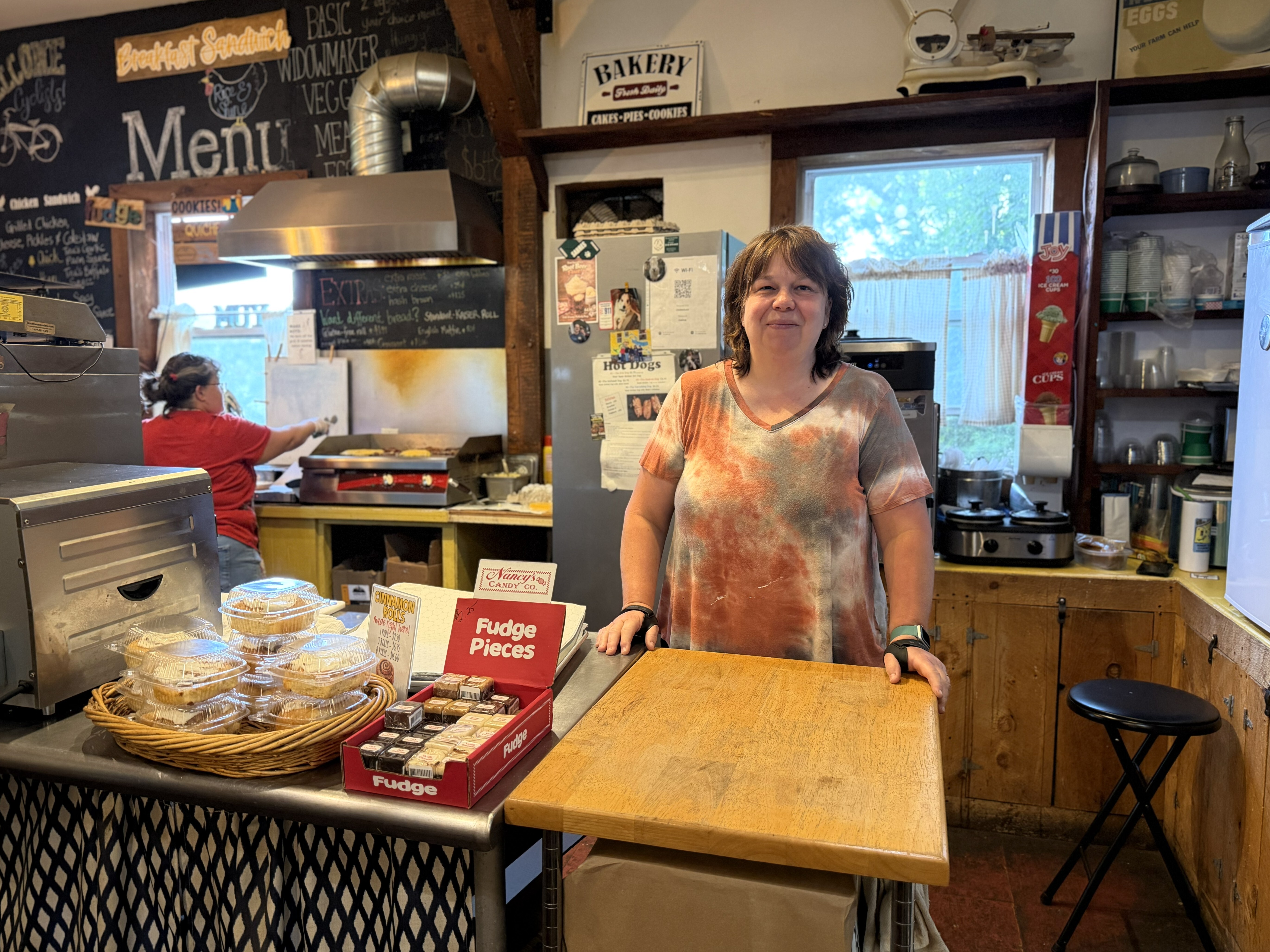 Louise standing behind the counter of the country store