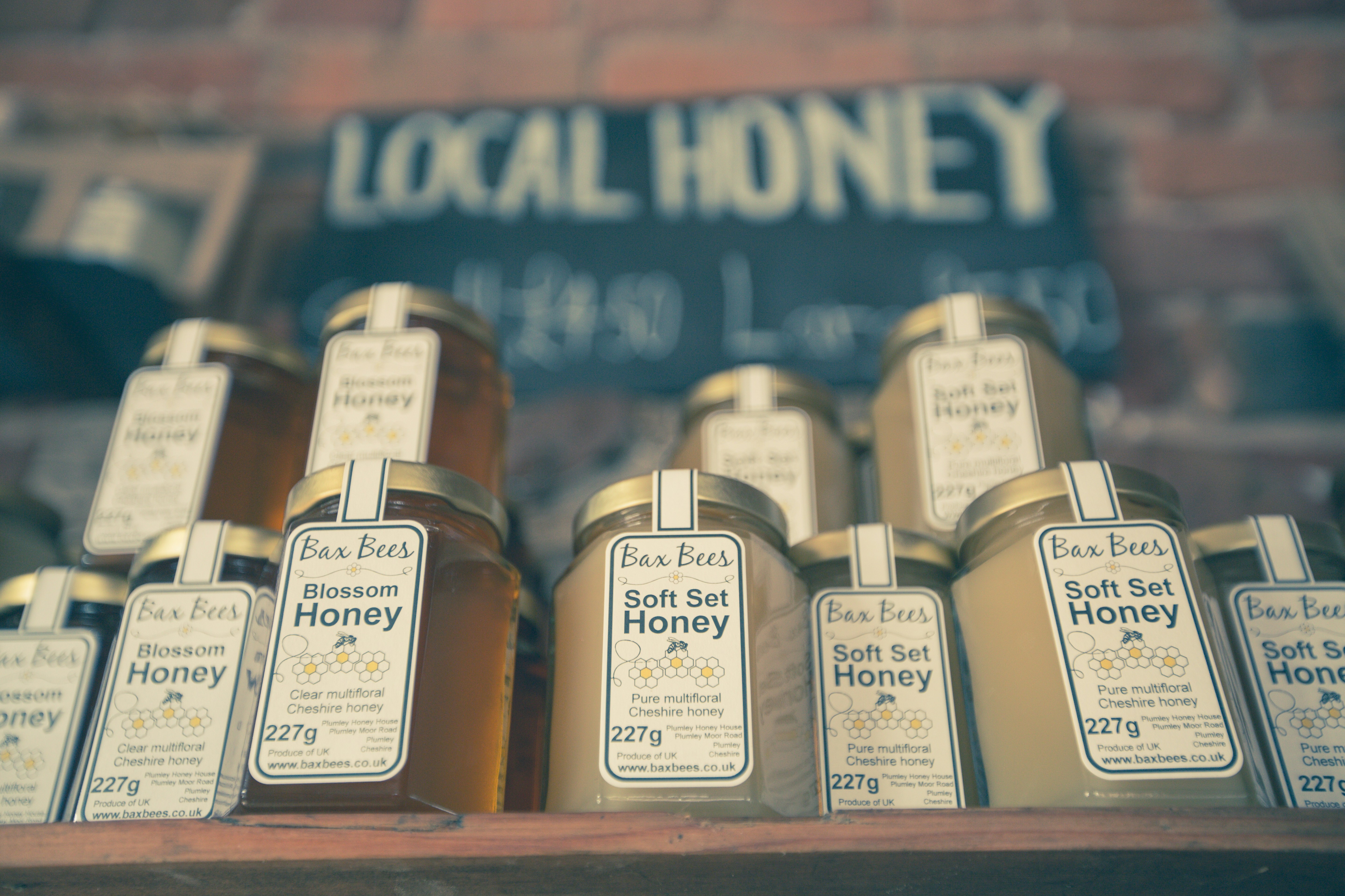 Hex jars of honey on a display shelf